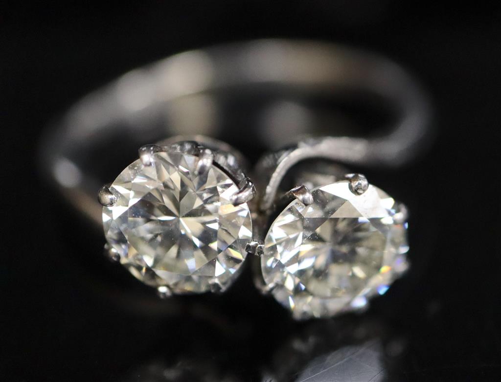 A platinum? and two stone diamond crossover ring,